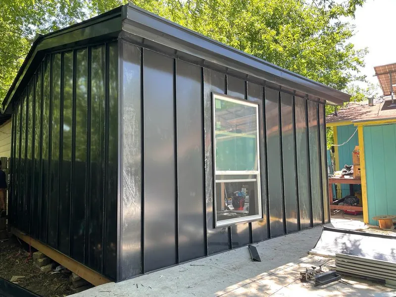 Black standing seam metal wall panels for Metal Roof Installation in Gouverneur