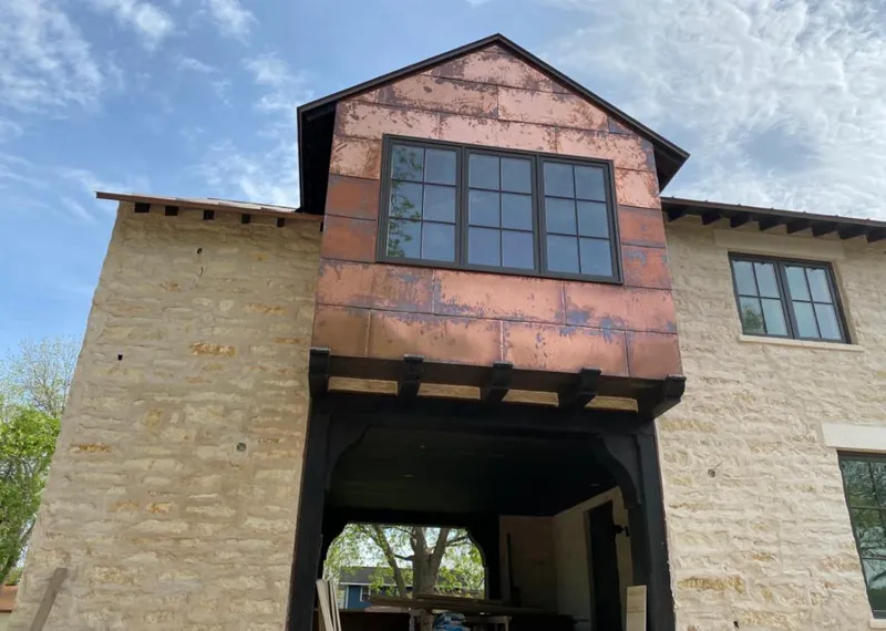 Copper metal panel facade on a stone building for Metal Roof Coating in Gouverneur
