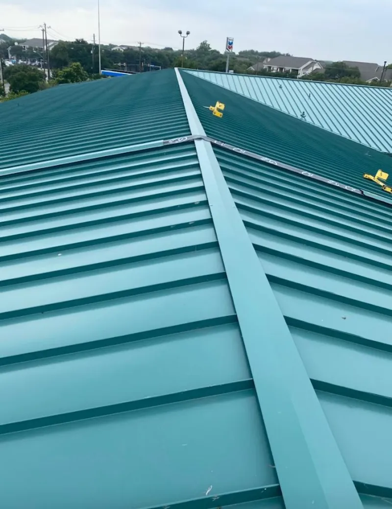 Green commercial metal roof ridge and valley for Metal Roof Repair in Gouverneur