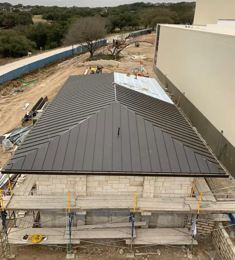 Metal roof new construction with scaffolding in Gouverneur